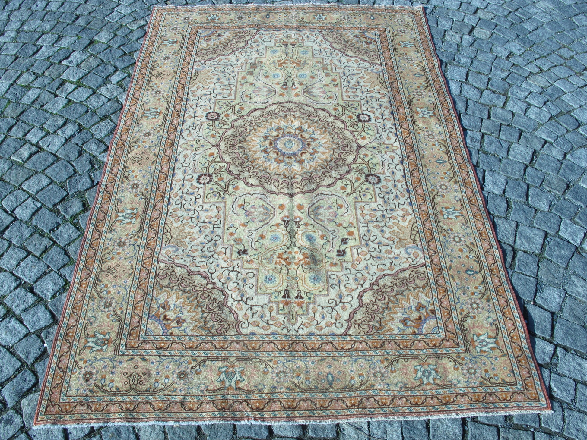 “Semi-antique handmade Rug with muted floral Oriental design in wool, 4.6x6.9 ft.”